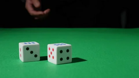 The hand throw the dice on the green game table. six six. Two sixes. Double Stock Footage 209309103