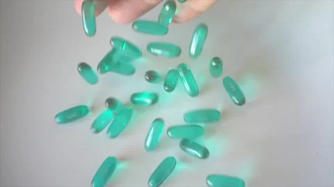 Hand throw pills in super slow motion Stock Footage 55861871