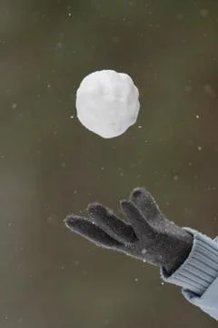 Hand throw up a snowball Stock Photos