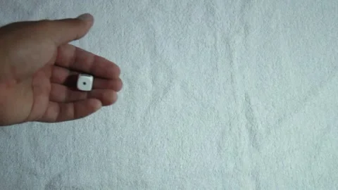 Hand throwing a 6-sided dice Stock Footage 146042152