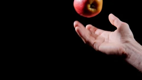 Hand throwing apple Stock Footage 98219183