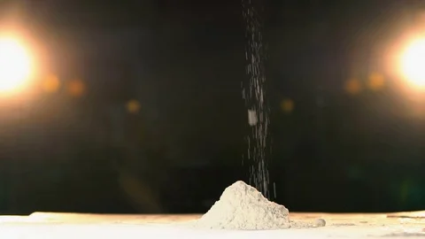 Hand throwing flour in a heap rapid. Hand throws white powder mountain slow mo. Stock Footage 72920761