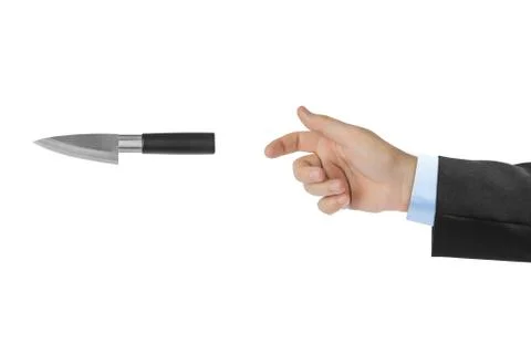 Hand is throwing a knife Stock Photos