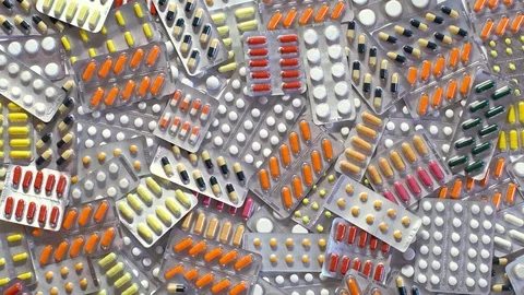 Hand throwing pills table. Arm Grabs tablet good white background. Stock Footage 72915552