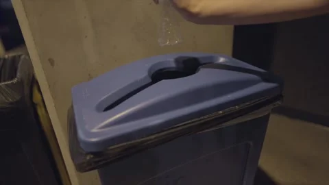Hand throws away plastic bottle Stock Footage 315140649