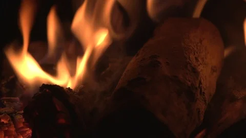 Hand throws a log into the fire close-up Stock Footage 120872419