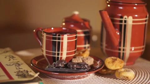 Hand throws a lump of sugar in tea, coffee Stock Footage 134887110