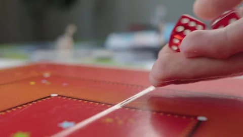 The hand throws red dices on the playing field. Gaming moments in dynamics. Stock Footage 282154192