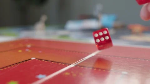 The hand throws red dices on the playing field. Gaming moments in dynamics. Stock Footage 282154250