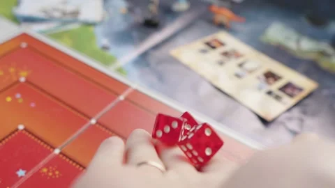 The hand throws red dices on the playing field. Gaming moments in dynamics. Stock Footage 282154333