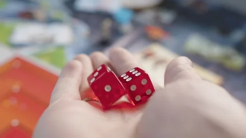 The hand throws red dices on the playing field. Gaming moments in dynamics. Stock Footage 282154451