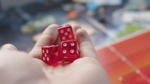 The hand throws red dices on the playing field. Gaming moments in dynamics. Stock Footage 282154463