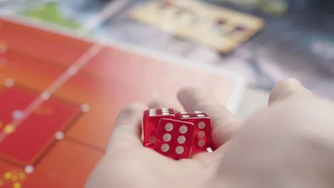 The hand throws red dices on the playing field. Gaming moments in dynamics. Stock Footage 282154505