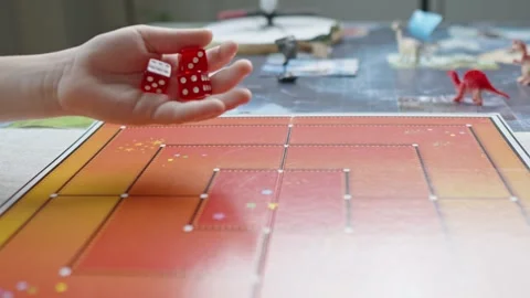 The hand throws red dices on the playing field Stock Footage 282255171