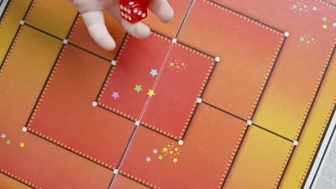 The hand throws red dices on the playing field Stock Footage 282255223