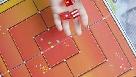 The hand throws red dices on the playing field Stock Footage 282255252