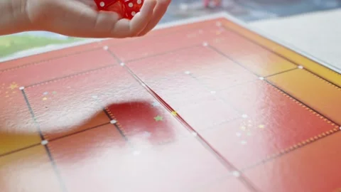 The hand throws red dices on the playing field Stock Footage 282255304