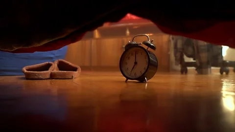 A hand throws a ringing alarm clock Stock Footage 132352015