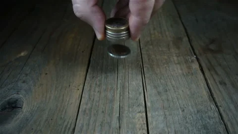 Hand throws a stack of euro coins in slow motion Stock Footage 132253032