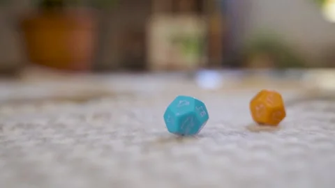 A Hand Throws Two Dice in slow motion. Close-up of Rotating Cubes and Fingers. Stock Footage 233523827