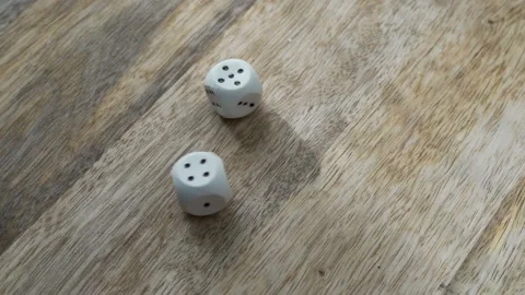 The Hand Throws Two Dice on the Wooden Table. The Concept Of Gambling, Winning,  Stock Footage 141666787