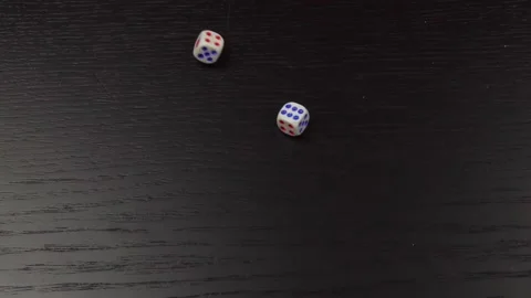 The hand throws two dice on the wooden table. Close-up Stock Footage 145638660