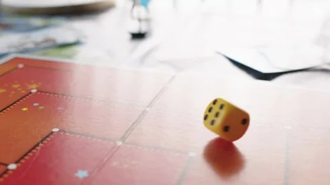 The hand throws yellow dices on the playing field. Gaming moments in dynamics Stock Footage 282153964