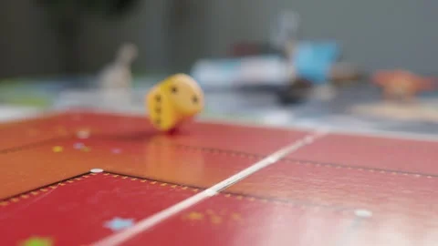 The hand throws yellow dices on the playing field. Gaming moments in dynamics Stock Footage 282154036