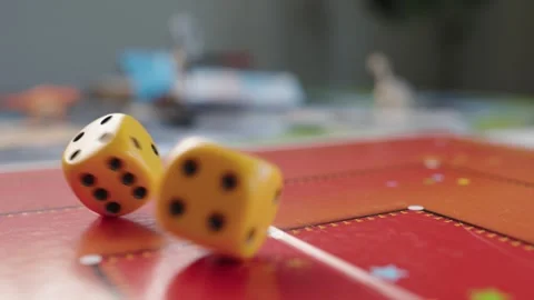 The hand throws yellow dices on the playing field. Gaming moments in dynamics Stock Footage 282154096