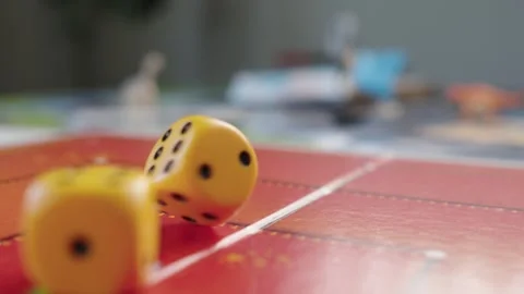 The hand throws yellow dices on the playing field. Gaming moments in dynamics Stock Footage 282154144
