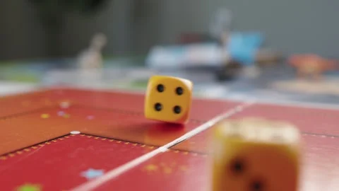 The hand throws yellow dices on the playing field. Gaming moments in dynamics Stock Footage 282154173