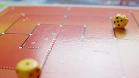 The hand throws yellow dices on the playing field. Gaming moments in dynamics Stock Footage 282255092