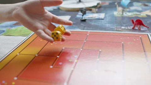 The hand throws yellow dices on the playing field. Gaming moments in dynamics Stock Footage 282255119