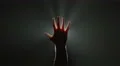 The hand thumb up on the background of bright light. Real time capture 4k or 4k+ Resolution