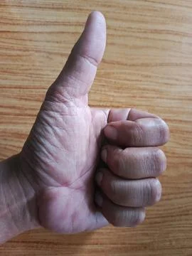 Hand with thumb facing up Stock Photos