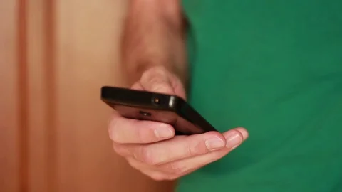 Hand thumbing through a smartphone Stock Footage 73506253
