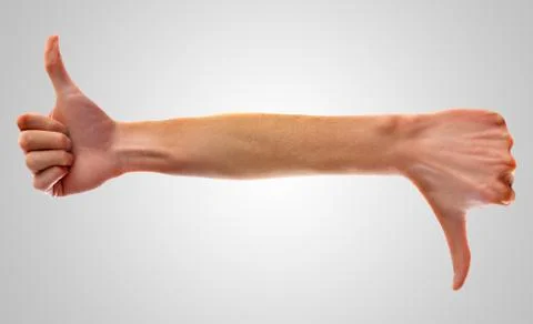 Hand with thumbs up on left side, and with thumbs down on right side Stock Photos