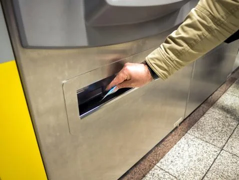 Hand with ticket on a vending machine Stock Photos