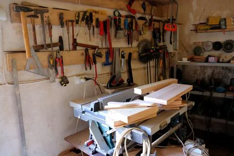 Hand tool on the background of the carpentry workshop. Stock Photos