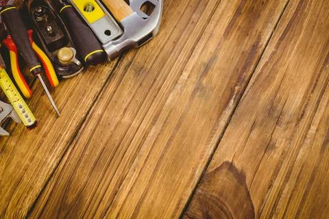 Hand tools are lying on workbench in flat vector illustration featuring hammer, Stock Photos