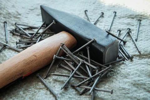 Hand tools, old tools. hammer and nails on a construction surface, close-up Stock Photos
