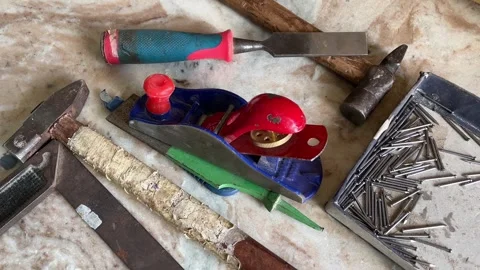 Hand Tools Set with Plane, Chisel, Hammer and Nails on Work Surface Stockbeeldmateriaal 324008609