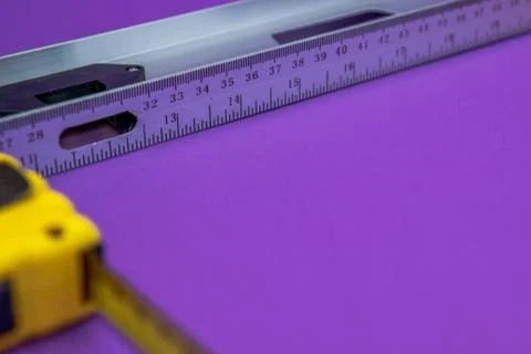 Hand tools yellow ruller, stapler, tape measure Stock Photos