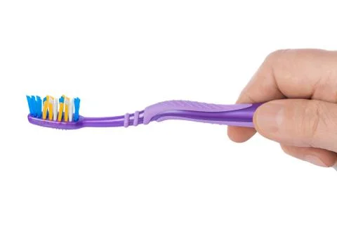 Hand with toothbrush Stock Photos