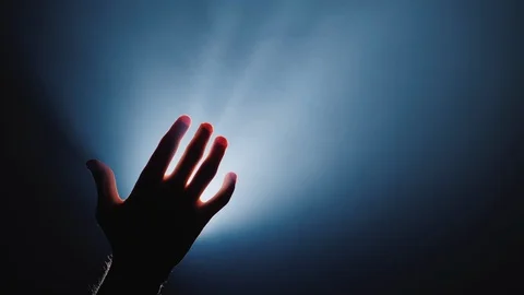 The hand on top holds the key to the man. Inspiration and help concept Stock Footage 122986672