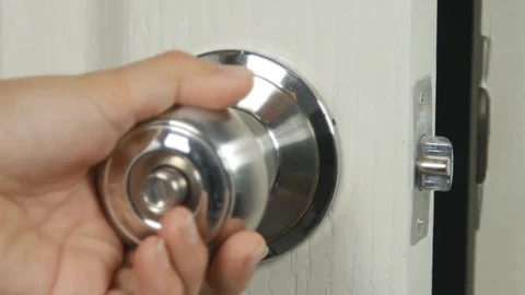 Hand Torque door knob to close and lock Stock Footage 73900527