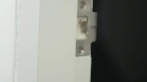 Hand Torque door knob to close. Stock Footage 73900597