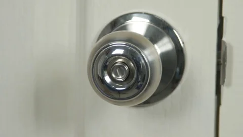 Hand Torque door knob to open. Video stock 73900464