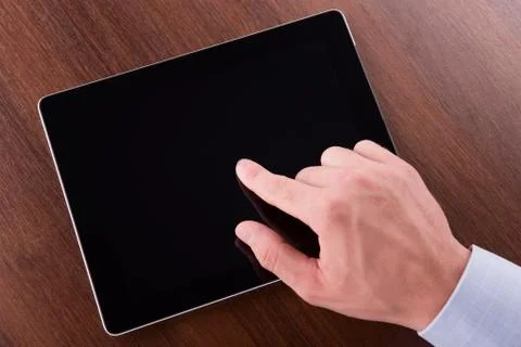 Hand on a touch screen of tablet pc 스톡 사진