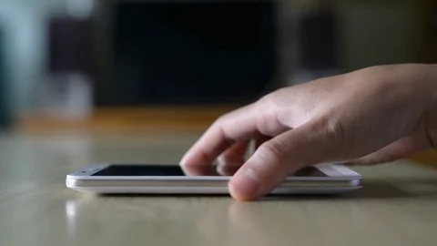 Hand touch on smart phone touchscreen. Stock Footage 77828963